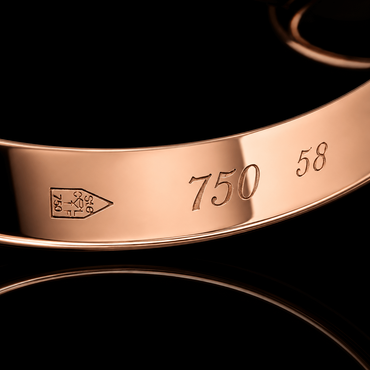 Cartier Trinity Ring Makroaufnahme der drei Goldringe